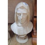 An antique carved marble bust of a hooded man, set on pedestal base