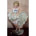 A modern reproduction painted cast iron Marilyn Monroe doorstop