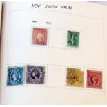 A red stamp album containing a collection of 19th Century and later hinge mounted stamps including