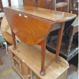 A 3' 3 1/2" 19th Century solid mahogany drop-leaf table with single gated action, set on heavy