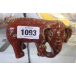 An antique Chinese pottery elephant with flambe glaze