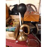 A vintage brass car horn with rubber bulb