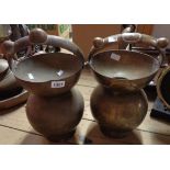 A pair of Indian brass kamaladu water vessels decorated with engravings of Hindu deities and the