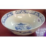 An antique Chinese blue and white bowl with figural decoration