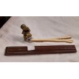 A brass figure, boxed chopsticks and a bone glove stretcher