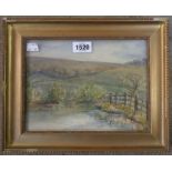 A gilt framed small watercolour, depicting a rural landscape with pool and fence in foreground