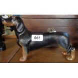 A cast metal daschound doorstop