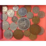 A small selection of assorted coins including a 1929 sixpence and other world coinage