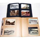 Two brown postcard albums containing a collection of 400 mainly early 20th Century postcards