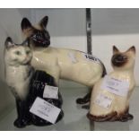 Two Beswick Siamese cats and another 1031 cat