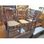 A harlequin set of four Edwardian walnut framed standard chairs with rattan seat panels and turned