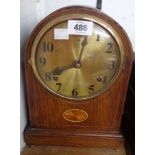 An early 20th Century inlaid oak cased dome top mantel clock with American gong striking movement