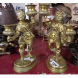 A pair of 19th Century cast brass figural candlesticks