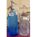 A blue glass soda syphon for T. Hoyes of Leicester and a clear Schweppes example