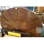 A 4' 3 1/2" diameter 19th Century flame mahogany sectional veneered breakfast table, set on heavy