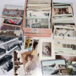 A shoebox containing a large collection early 20th Century and later postcards including numerous