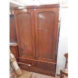 A 4' Victorian mahogany double wardrobe with hanging space enclosed by a pair of panelled doors over