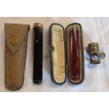 A Dunhill cigarette holder with 9ct gold collar in its original kid leather pouch sold with a