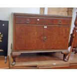 A 36" early 20th Century figured walnut veneered cabinet with long frieze drawer and pair of