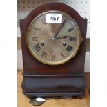 An early 20th Century stained walnut cased mantel clock with German eight day striking movement