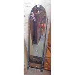 A 20th Century stained oak framed cheval mirror with arched plate and linen fold decoration to base,