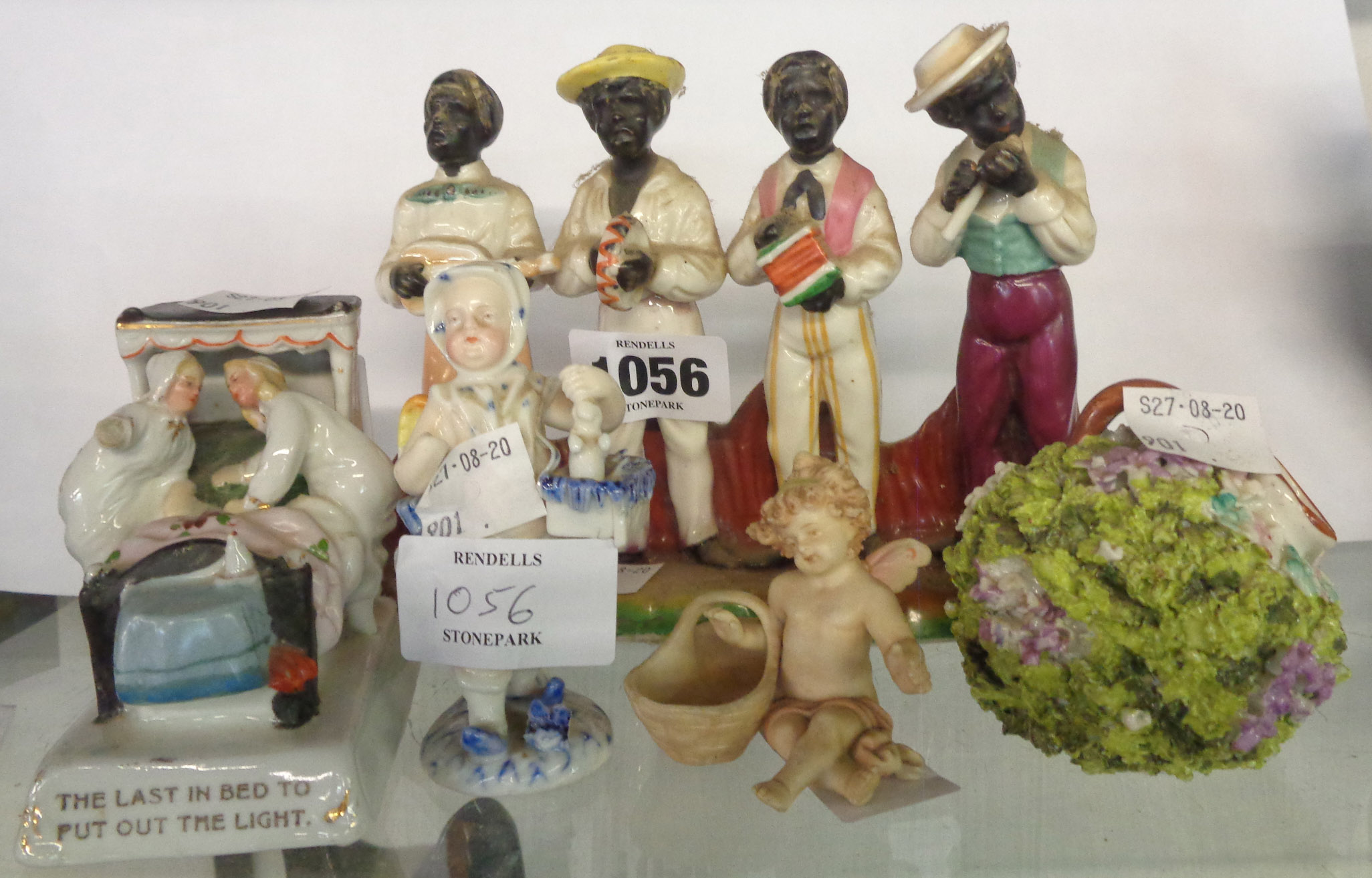 A small quantity of 19th Century figurines including a black quartet, a fairing, etc. - various