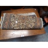 A small machine made rug decorated with central cartouche and frieze border - measurements available