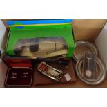 A box containing assorted motoring collectables including a Mercedes Benz keyring, Lesney pen stand,