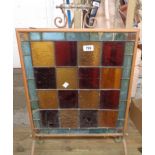 A late 19th Century tubular copper fire screen with stained glass panel - some damage to glass