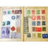 A Lincoln stamp album containing a collection of 19th century and later hinge mounted world stamps