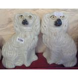 A pair of Staffordshire spaniels - one a/f