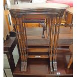 A nest of three reproduction mahogany Georgian style tea tables with shaped surfaces, set on slender