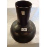 An Oriental bronze turned bottle vase of baluster form