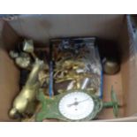 A box containing assorted metalware, including enamel faced scales, weights and brass figurines