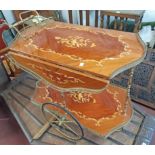 A vintage drink's wagon with highly polished inlaid surfaces, drop-leaf top and brass galleries