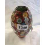 A vintage Japanese cloisonne jar of ovoid form, decorated with flowerheads and butterflies on a