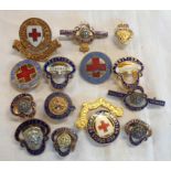 A small collection of enamelled badges, British Red Cross and other examples