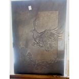 A Devon Guild of Craftsmen carved Cornish slate picture of a bird of prey in flight above a treasure