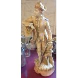 A large continental pottery figurine of a gentleman in period dress - a/f