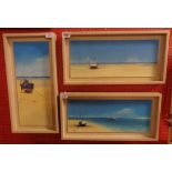 Three similar bleached wood framed coloured prints, depicting beached vessels