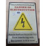 A reproduction cast metal danger of electrocution sign