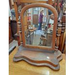 A Victorian platform dressing table mirror with arched plate and serpentine base - for re-polishing