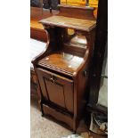 A late Victorian oak coal perdonium with mirror set shelf top and panelled fall-front - damage