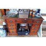 A 3' 6" Edwardian walnut twin pedestal desk with tooled green leather inset top, three frieze