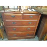 A 3' 6" Edwardian stained oak chest of two short and three long graduated drawers, set on plinth