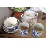 A Chinese two handled cup with saucer, two tea bowls, two saucers, two cups - various condition