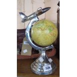 A small globe with alloy model aeroplane to top