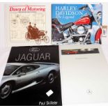 A small collection of automobila related books and ephemera including Harley Davidson, Jaguar, etc.