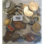 A bag of assorted medals, medallions, etc.