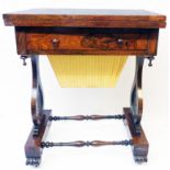 A 24" Victorian rosewood games/work table with chess board to fold-over top, paper lined frieze